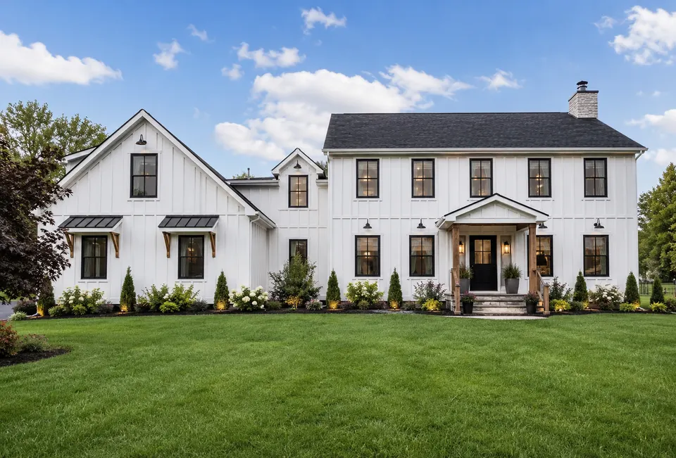 White farmhouse with black trim, a Hudson Valley renovation-style home